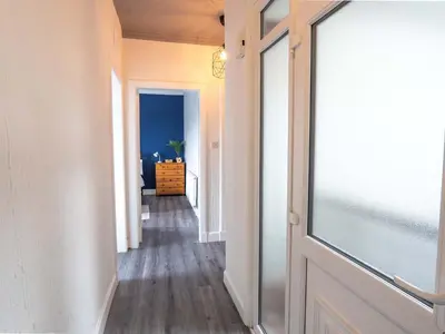 a hallway with an open door to a room at Pitchside Escape in Ayr