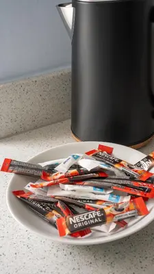 a plate of toothbrushes and toothpaste on a table at 3 BDR House By Caledonia Luxe Stays Short Lets & Serviced Accommodation Broxburn in Broxburn