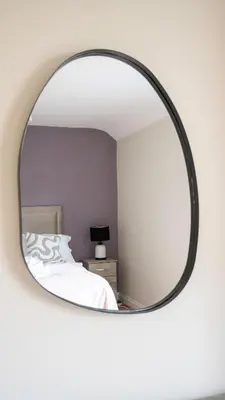 a mirror in a bedroom with a bed at Pinkerton House in Dunfermline