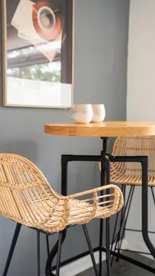 a dining room table with two chairs and a wooden table at Torbrex House in Cumbernauld