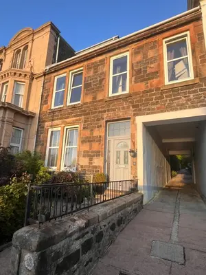 a brick house with a garage in front of it at Harbour View in Rothesay