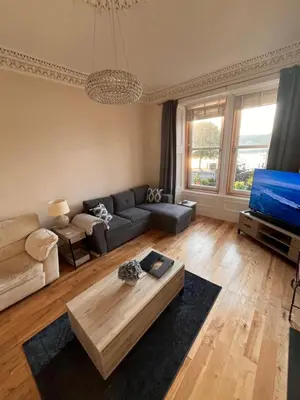 a living room with a couch and a coffee table at Harbour View in Rothesay