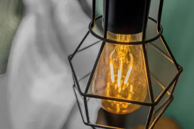 a black and gold lantern with lights in it at Free Parking - Central - Sleeps 6 - 2 Bedrooms in East Calder