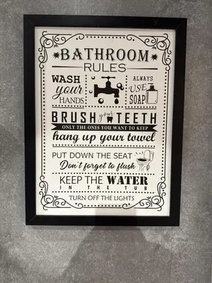 a framed picture of aption of a bathroom rules at 2 bedroom cottage in Ayr