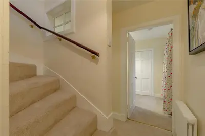 a staircase in a home with a stair case at New Town Cottage in Edinburgh