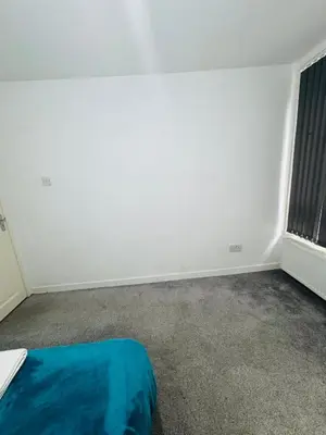 an empty room with a bed and a window at Private Room in Glasgow City in Hillfoot