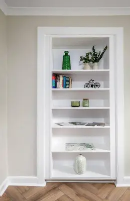 a white book shelf with plants and vases on it at Modern Comfort in Historic Callander in Stirling