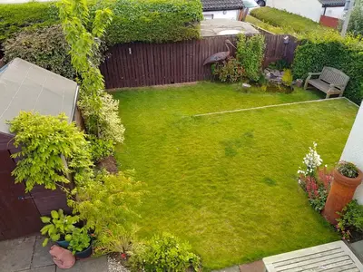 an aerial view of a small yard with a lawn at Comfortable room with en suite in Edinburgh