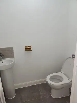 a bathroom with a toilet and a sink at Edinburgh Road Nuneaton in Moffat