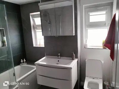 a bathroom with a sink and a tub and a toilet at Quiet 5BR Ideal for Groups in Moffat