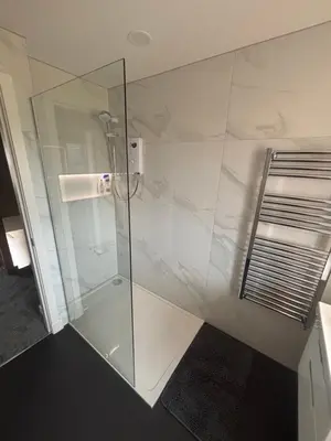 a shower with a glass door in a bathroom at 25 Colliers Road,Stirling