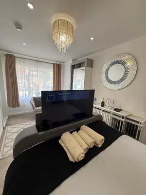 a bedroom with a bed with two towels on it at Edinburgh city break room in Edinburgh
