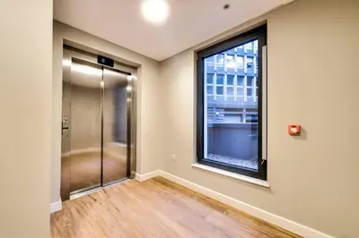 an empty room with a glass door and a window at Lovely 1-Bedroom Unit Near Edinburgh Castle in Edinburgh