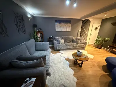 a living room with two couches and a table at Traveler Nest in Moffat