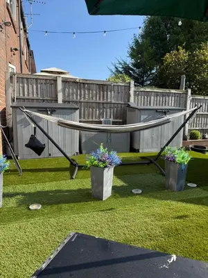 a ping pong table in a yard with two potted plants at Traveler Nest in Moffat
