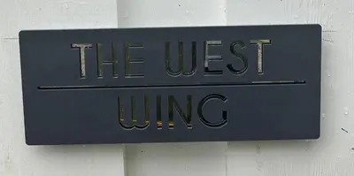 a sign that reads the west wing on a wall at The West Wing - 1Bedroom Annexe with parking in Oban