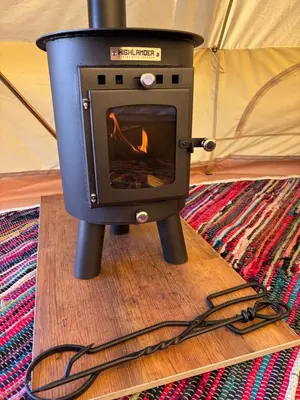 a stove sitting on top of a wooden table at Infinite Sky camping in Moffat