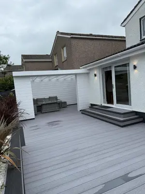 a backyard with a deck and a house at Best stay in the bay in Saint Davids