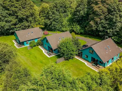 an overhead view of two houses on a lawn at Foxglove Cottage 2 - Uk50020 in Drymen