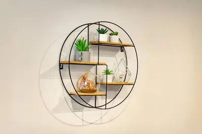 a circular shelf with potted plants on a wall at The Loft - 3 bedroom in Crieff in Crieff