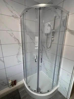 a shower with a glass door in a bathroom at Newly Renovated Flat Edinburgh - 2 x Double Beds in Edinburgh