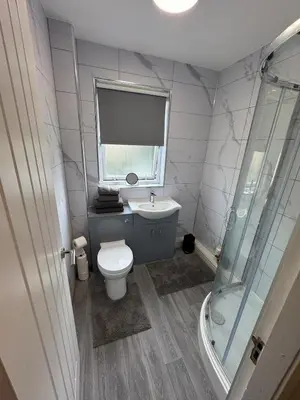 a bathroom with a toilet and a sink and a shower at Newly Renovated Flat Edinburgh - 2 x Double Beds in Edinburgh