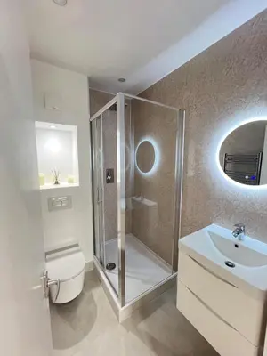 a bathroom with a shower and a toilet and a sink at Flat in London Bridge in Moffat