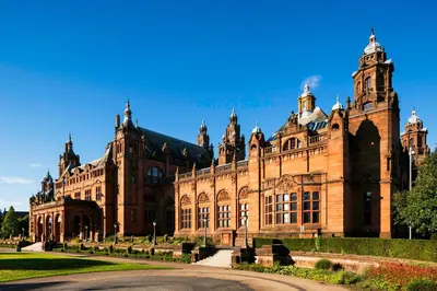 a large brick building with a road in front of it at The Clyde Retreat, 2 Bedrooms in Glasgow