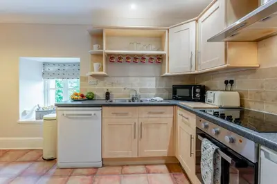 a kitchen with wooden cabinets and a sink at 2 Bed in Methven oc-c32362 in Methven