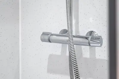 a shower head with a hose attached to a wall at Super Prime The City Residence in Dunfermline
