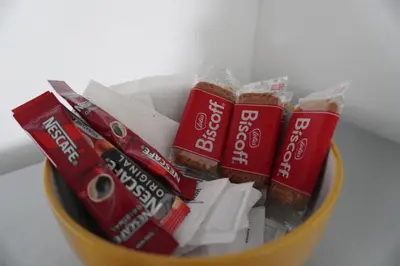 a bowl filled with packets of chips and snacks at Detached Home in Bishopton in Bishopton