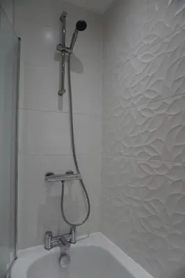 a shower in a bathroom with a sink at Detached Home in Bishopton in Bishopton