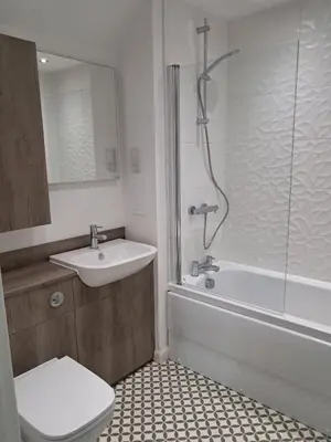 a bathroom with a toilet and a sink and a shower at Detached Home in Bishopton in Bishopton