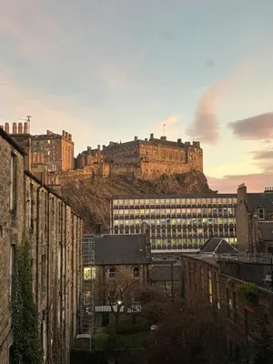 a city with a castle on top of a hill at Modern One Bed Flat, Historic Old Town Edinburgh in Edinburgh