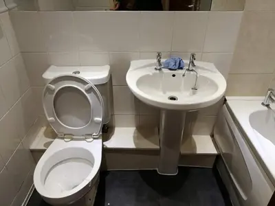 a small bathroom with a toilet and a sink at Glasgow Property New City Rd in Glasgow