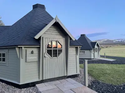 a building with a window on the side of a house at Carnethy Cabin in Kirknewton