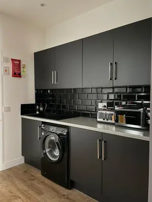 a kitchen with a washing machine in a kitchen at Foundry Street Apartment 1 - Dunfermline City Centre in Dunfermline