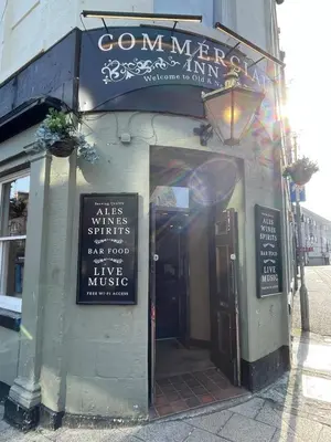 a entrance to a restaurant with a sign on the door at Foundry Street Apartment 3 - Dunfermline City Centre in Dunfermline