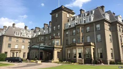 a large building with a car parked in front of it at 28 Guthrie Court - Gleneagles Village