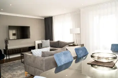 a living room with a couch and a table at 28 Guthrie Court - Gleneagles Village
