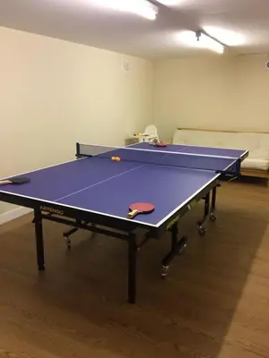 a ping pong table in a room with two tables at Memorising sea views contemporary, spacious 4 bedroom coastal villa near Oban in Craobh Haven