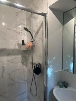 a bathroom with a shower and a sink at Central London in Moffat