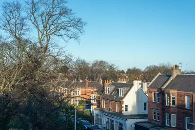 a view of a city with houses and trees at Cosy 2-bedroom Edinburgh flat close to city centre in Edinburgh