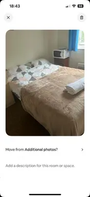 a bedroom with a bed with a keyboard on it at Serenity Space in Glasgow