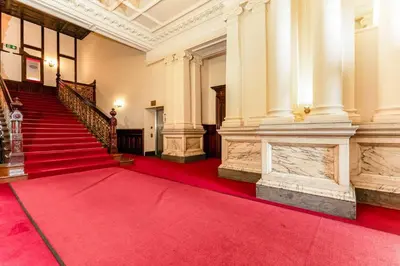 a red carpet in a building with a red carpet at Quay Glasgow Duplex apartment in Glasgow