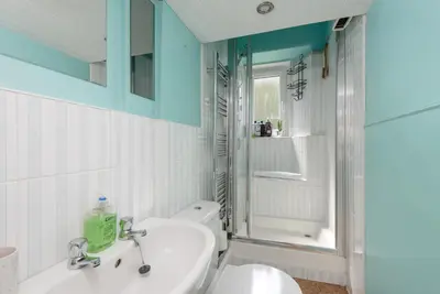 a bathroom with a sink and a toilet and a shower at Double Edinburgh Homestay in Edinburgh