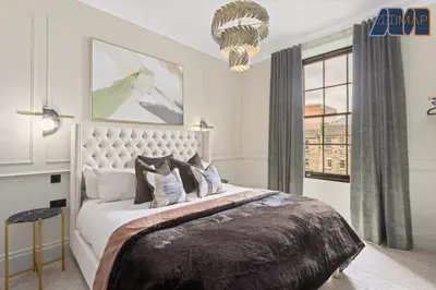 a bedroom with a large bed and a window at 3Bed Sleeps6 EdinburghCityCentre in Edinburgh