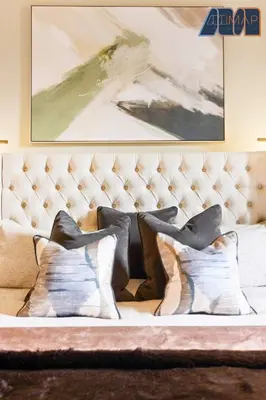 a white couch with pillows on it with a painting at 3Bed Sleeps6 EdinburghCityCentre in Edinburgh