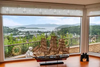 a room with a large window with a view at Spacious 4BD Home with Stunning Oban Views in Oban