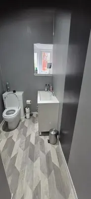 a bathroom with a toilet and a sink at 46 High Street in Campbeltown